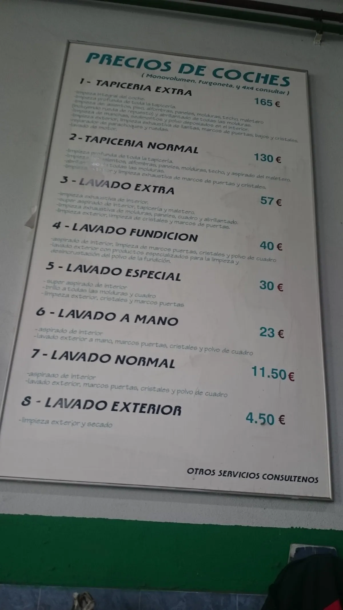 Cartel de precios de lavado y tapicería de Garaje Miguel SL