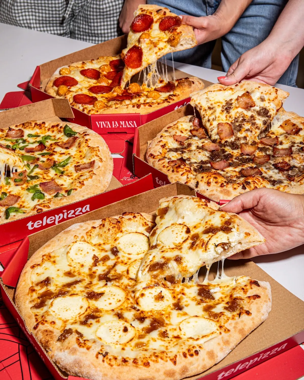 Varias pizzas de Telepizza en cajas para compartir.